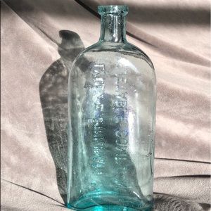 Antique bottle, and a riveting piece of history.